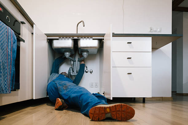 Professional Plumbing technician working in Mountainburg, AR